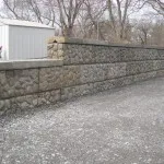 Stone retaining wall built by Sam Long Landscaping on Grand Island
