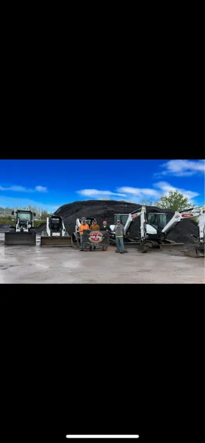 Sam Long Landscaping crew with equipment fleet